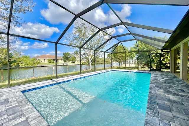 Screened heated pool and lanai overlooking the canal at 2211 NE 1st Ter, Cape Coral